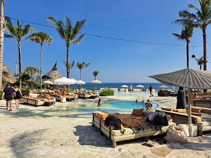 Mari Beach Club Bali beachfront pool and daybeds