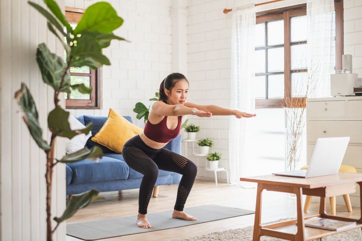 young woman stretching before Fitness and Exercise