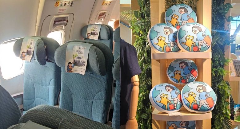 Ilustrasi komik Tahilalats di headrest cover pesawat Sky Explorer dan merchandise di Garuda Experience Store.